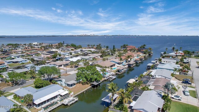 bird's eye view featuring a residential view and a water view