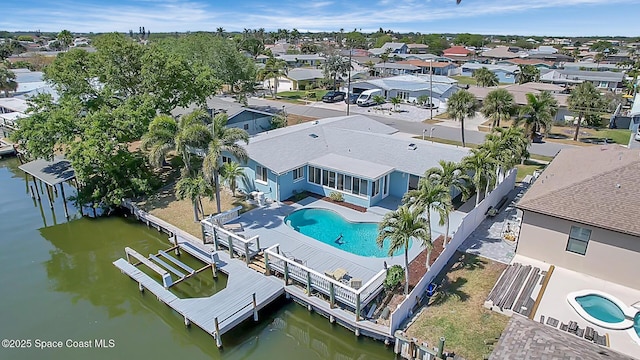 bird's eye view with a residential view and a water view