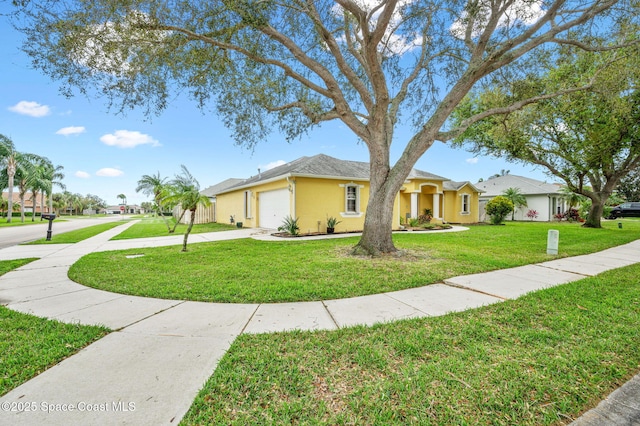 ranch-style home with a garage, driveway, a front lawn, and stucco siding