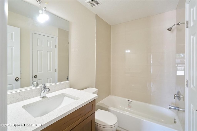 bathroom with visible vents, vanity, toilet, and shower / bathtub combination