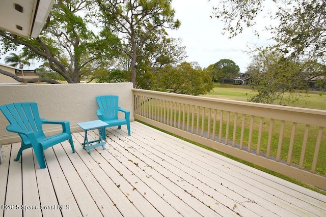 deck featuring a yard