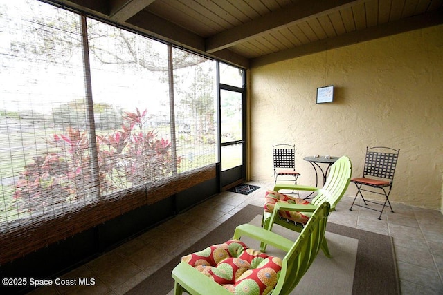 sunroom with wooden ceiling and beamed ceiling