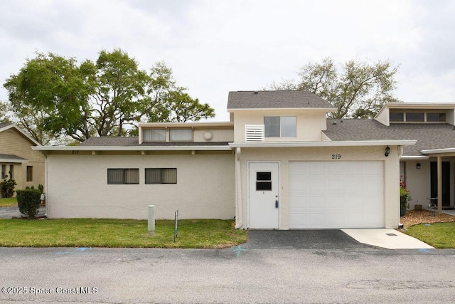 view of front facade with aphalt driveway, stucco siding, a shingled roof, a garage, and a front lawn