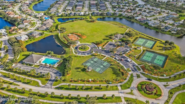 bird's eye view with a residential view and a water view