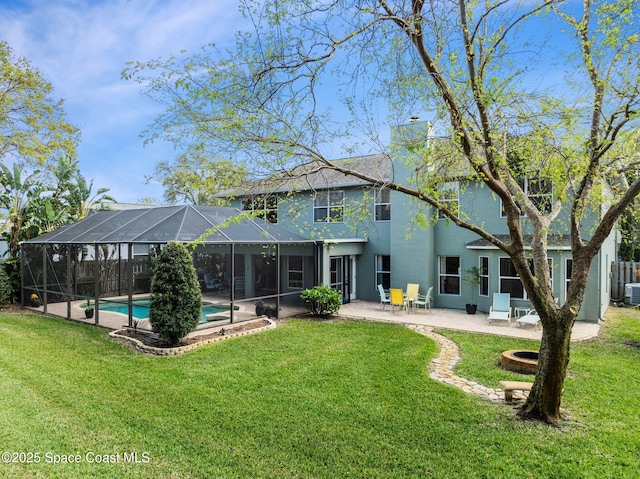 rear view of property with glass enclosure, a lawn, a patio area, and an outdoor pool