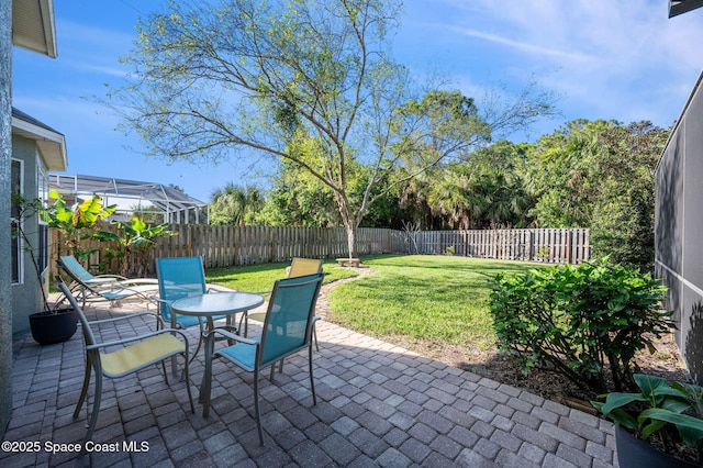 view of patio featuring outdoor dining area and a fenced backyard