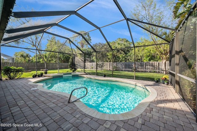 view of pool featuring a lanai, a fenced backyard, a lawn, and a patio