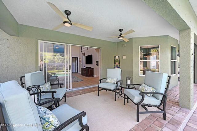 view of patio / terrace featuring ceiling fan and an outdoor hangout area