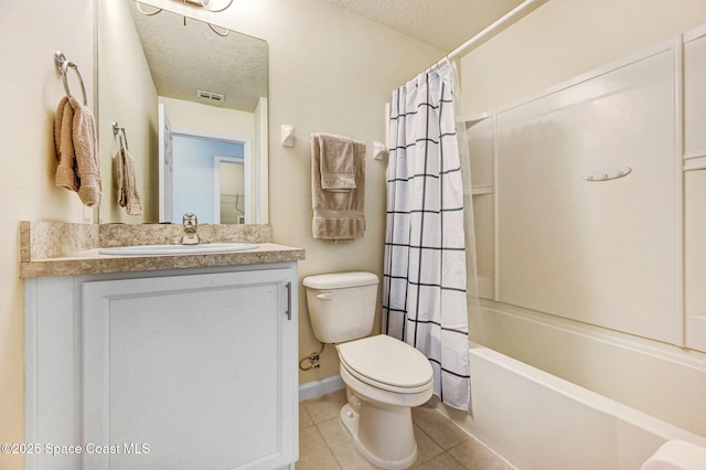 bathroom with a textured ceiling, toilet, tile patterned flooring, and visible vents