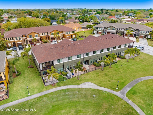 birds eye view of property with a residential view