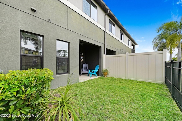 view of yard featuring a patio area and fence