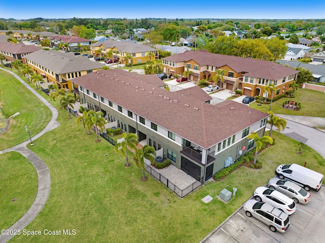 birds eye view of property with a residential view