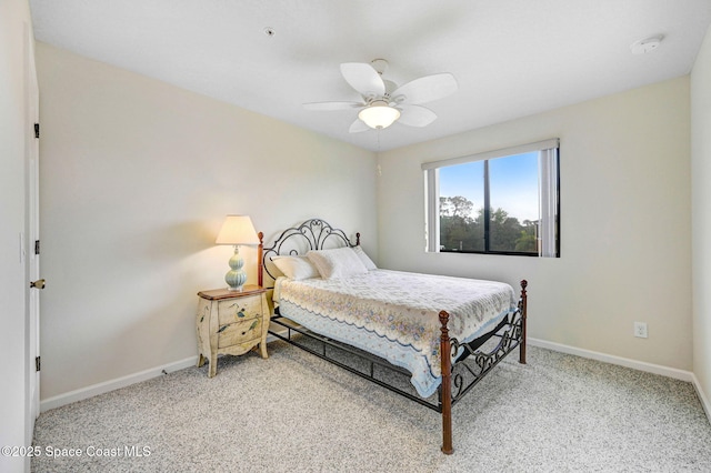 bedroom with carpet floors, baseboards, and a ceiling fan