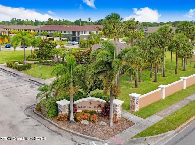 surrounding community featuring a yard, a residential view, and fence