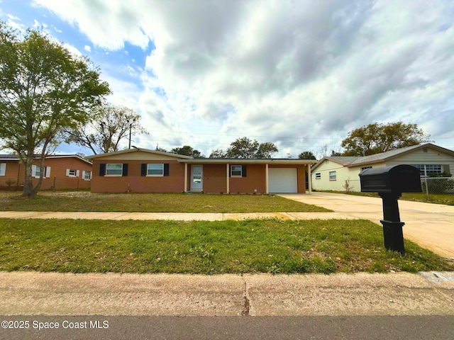 single story home with a garage, concrete driveway, and a front lawn