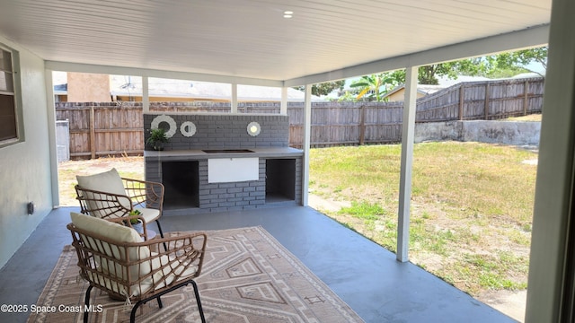 1151 Covina St, Cocoa, FL 32927 - view of patio featuring a fireplace