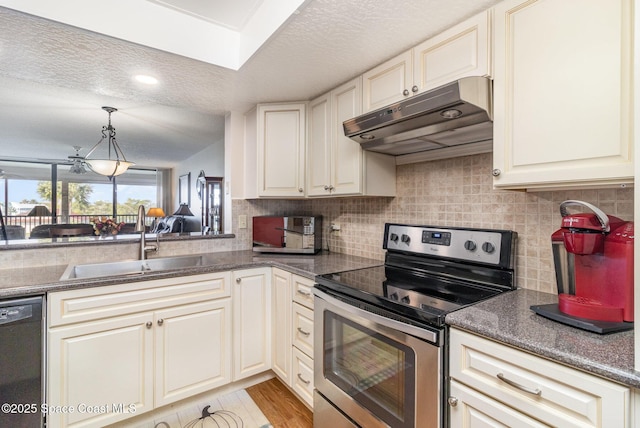 kitchen featuring dishwashing machine, a sink, stainless steel range with electric cooktop, under cabinet range hood, and backsplash