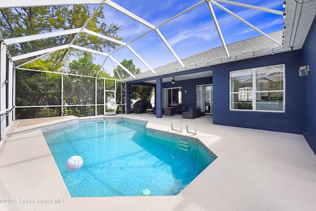 pool with a lanai, a patio area, ceiling fan, and an outdoor living space