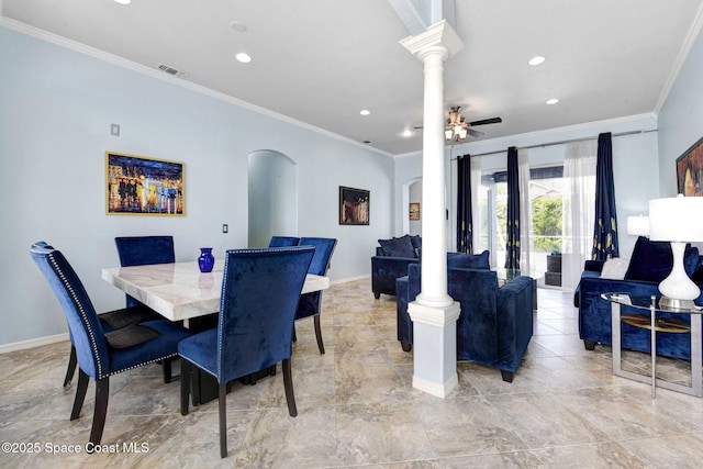 dining room with baseboards, visible vents, arched walkways, and ornamental molding