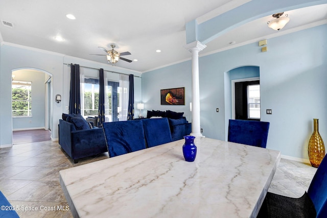 dining room featuring ceiling fan, recessed lighting, crown molding, baseboards, and ornate columns