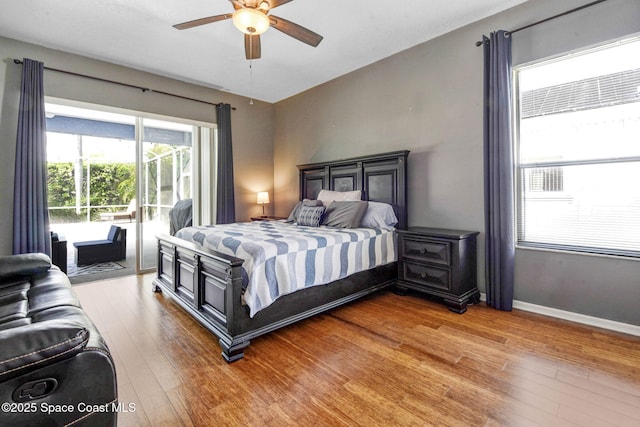 bedroom featuring baseboards, light wood finished floors, a ceiling fan, and access to exterior