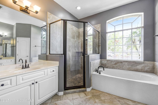 bathroom featuring a bath, visible vents, a shower stall, and vanity