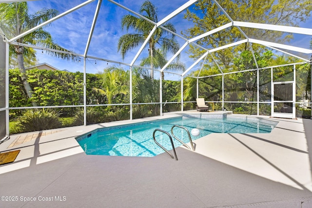 pool featuring a lanai and a patio area