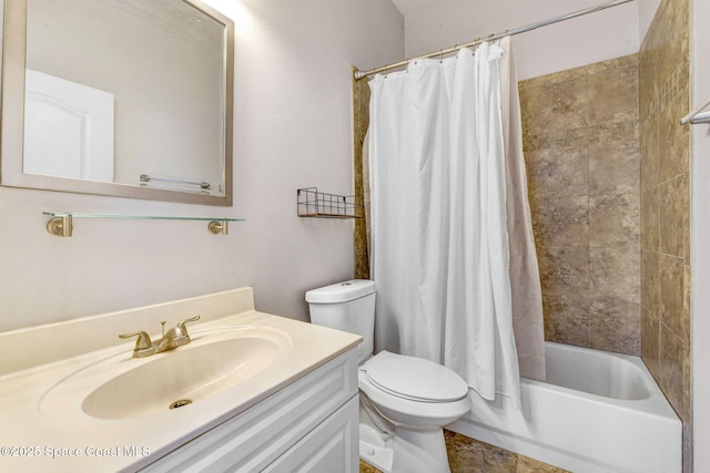 full bath with shower / bath combo, vanity, and toilet