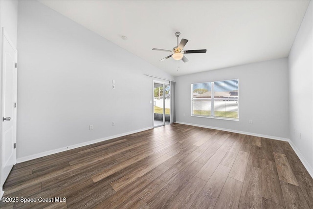 unfurnished room with dark wood-type flooring, lofted ceiling, baseboards, and a ceiling fan