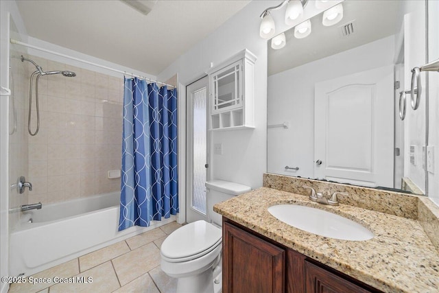 full bathroom featuring tile patterned flooring, toilet, visible vents, vanity, and shower / tub combo with curtain