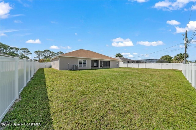 view of yard with a fenced backyard and cooling unit