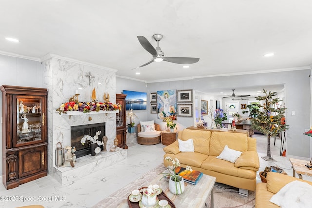 living area with marble finish floor, ornamental molding, a premium fireplace, and recessed lighting