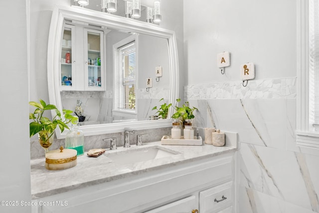 bathroom featuring tile walls and vanity