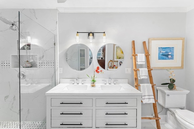 bathroom with toilet, double vanity, a sink, and a marble finish shower