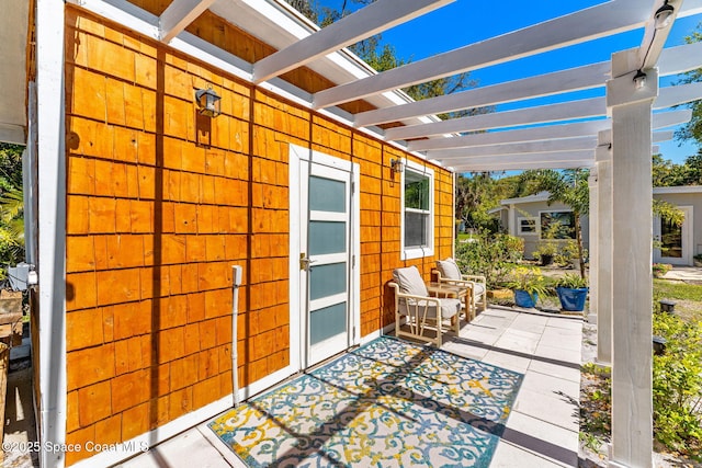 view of patio featuring a pergola