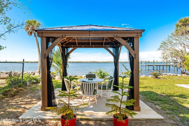 view of patio featuring a water view and a gazebo