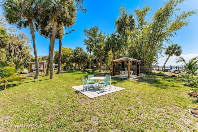 view of yard featuring a patio area, fence, and a gazebo