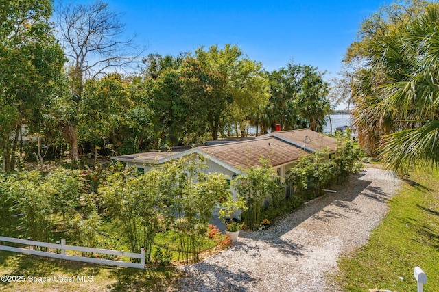 exterior space featuring driveway and fence