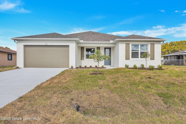 ranch-style house with a front lawn, driveway, an attached garage, and stucco siding