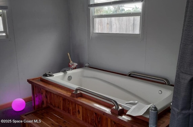 bathroom with a garden tub