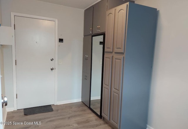 kitchen featuring light wood finished floors and baseboards