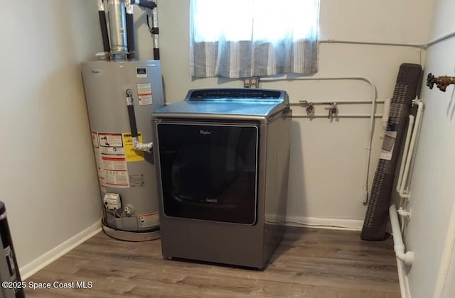 laundry area with gas water heater, laundry area, wood finished floors, baseboards, and washer / clothes dryer