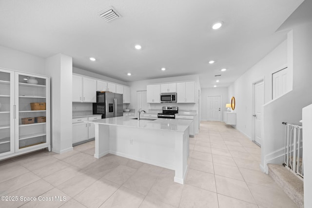 kitchen with white cabinetry, visible vents, appliances with stainless steel finishes, and recessed lighting