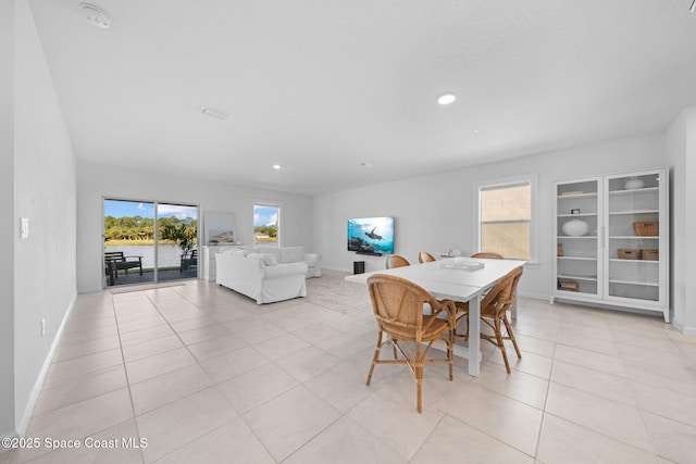 dining area featuring recessed lighting, plenty of natural light, baseboards, and light tile patterned floors