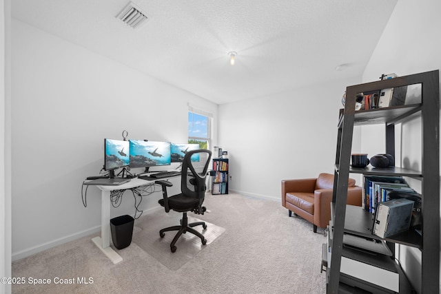 home office featuring carpet floors, baseboards, and visible vents