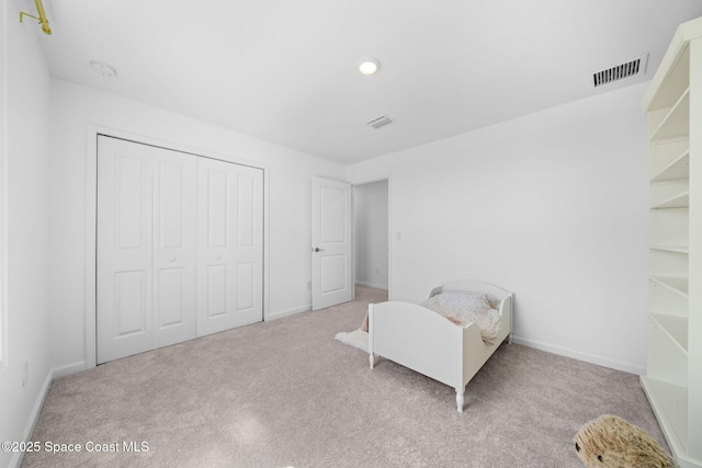 sitting room featuring carpet floors, visible vents, and baseboards