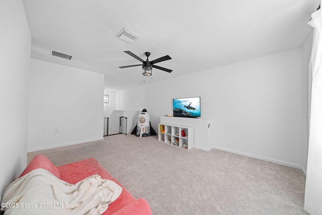 game room with carpet floors, baseboards, visible vents, and a ceiling fan