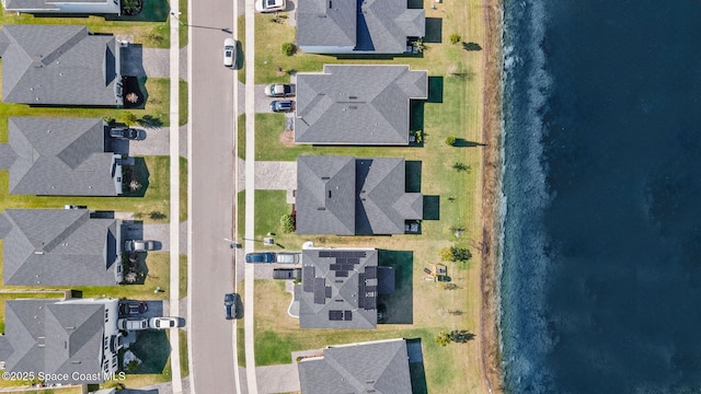 aerial view featuring a water view and a residential view