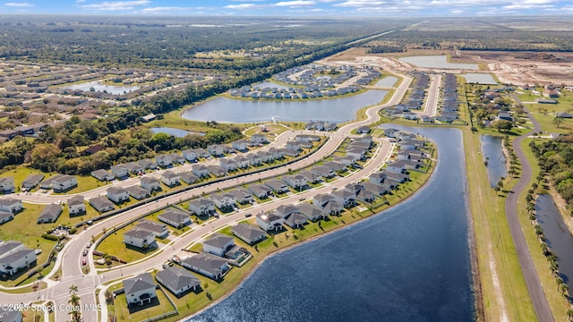 aerial view with a water view and a residential view