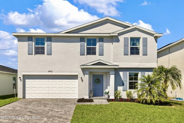 1865 Diablo Cir SW, Palm Bay, FL 32908 - traditional home with stucco siding, an attached garage, decorative driveway, and a front lawn